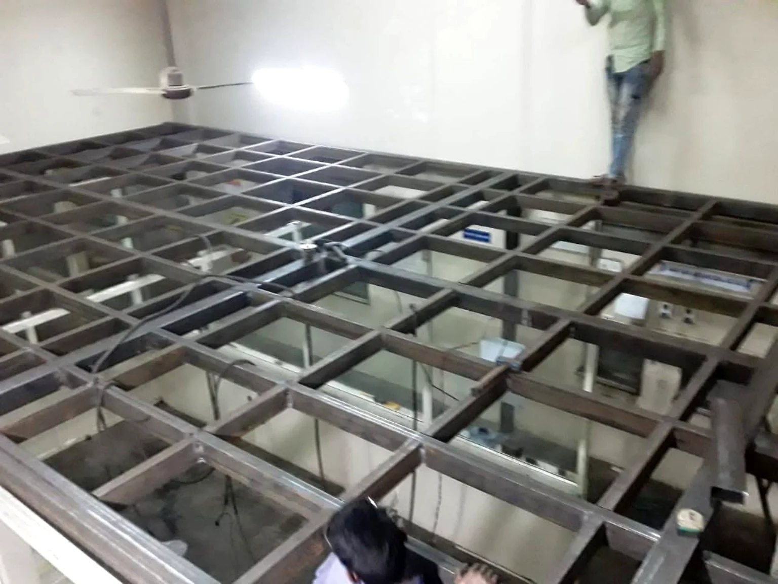 Dense steel grid frame for mezzanine or elevated floor construction.