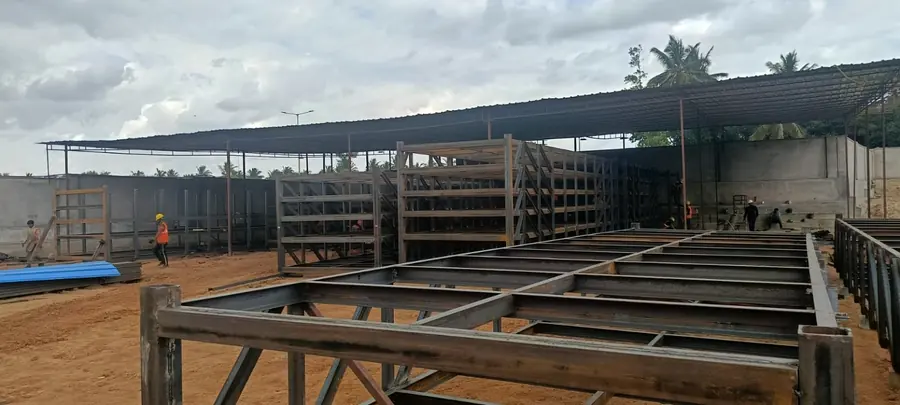 Heavy steel beam and secondary member fabrication for an elevated structure.