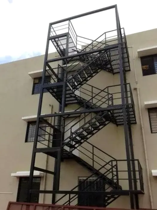 External industrial steel staircase and landing structure.