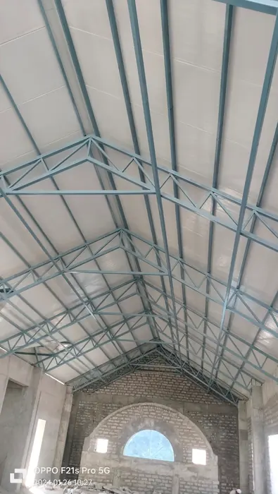 PUF roofing structure in progress with framed steel members.